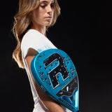 Woman holding a blue paddle with a brand logo against a black background
